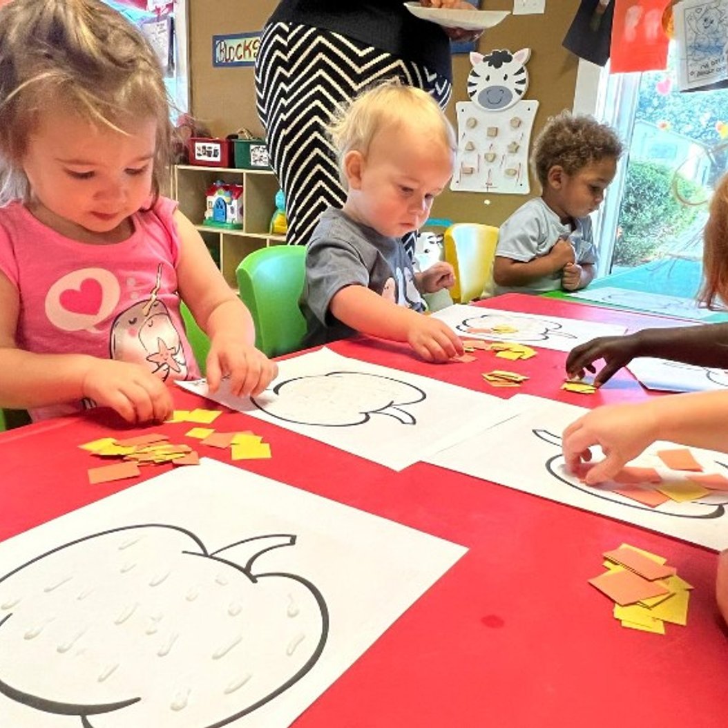 Toddlers in Busy Bees classroom, Valdosta GA, engaged in creative activities.
