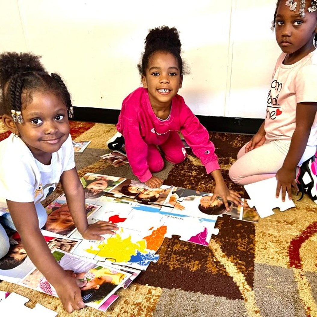 Children in a Valdosta Pre-K program working on a puzzle to build early academic skills and kindergarten readiness.