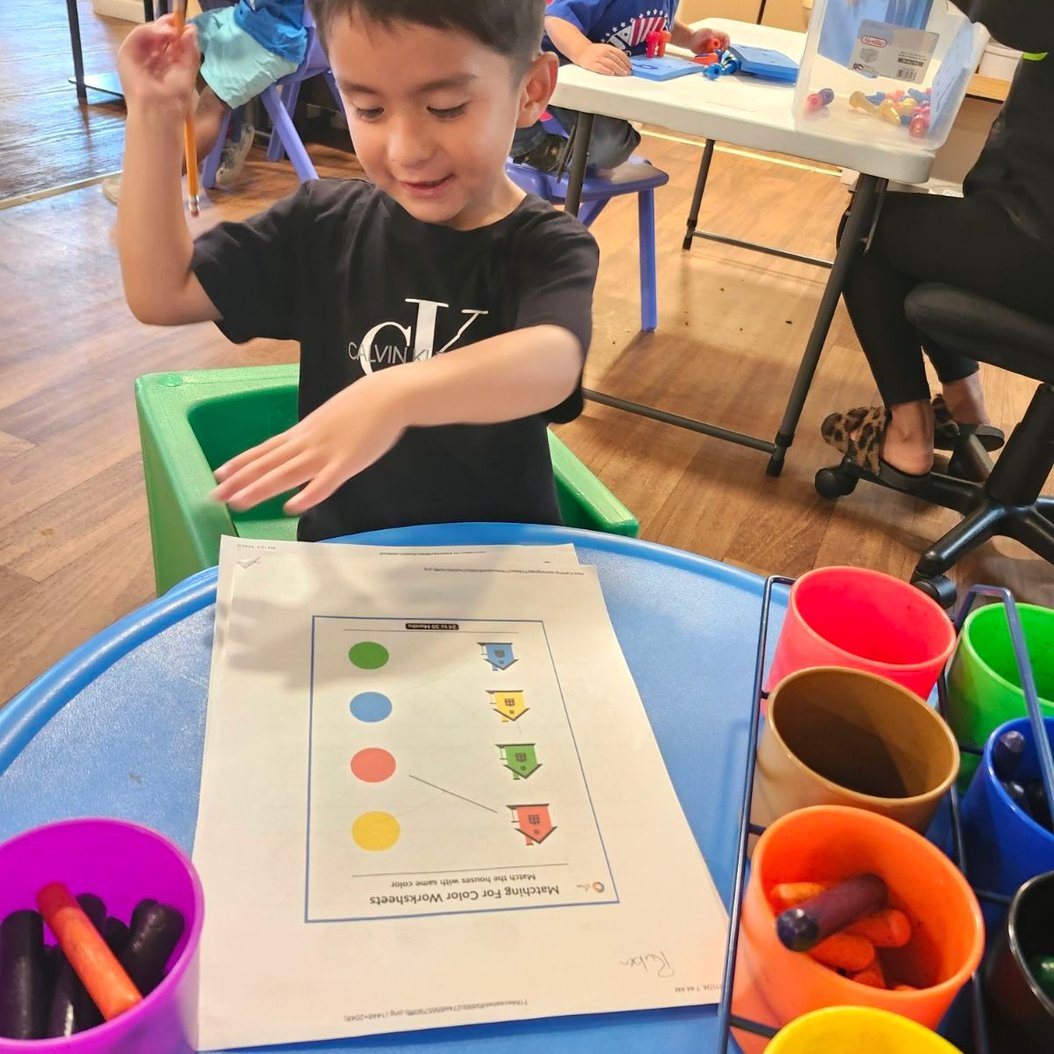 Children playing and learning at Red Trolleys Daycare, Valdosta, highlighting enrollment process activities.