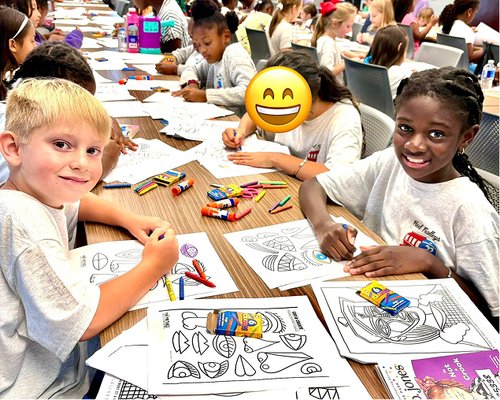 Children coloring at Red Trolleys Daycare in Valdosta, GA, enjoying creative activities and learning.