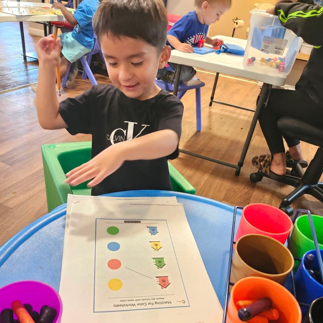 Pre-K children in Valdosta engaging in a fun classroom activity, building early academic skills and confidence.