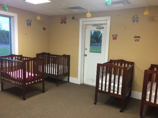 Infants in a nurturing classroom environment at Red Trolleys Daycare in Valdosta, GA.
