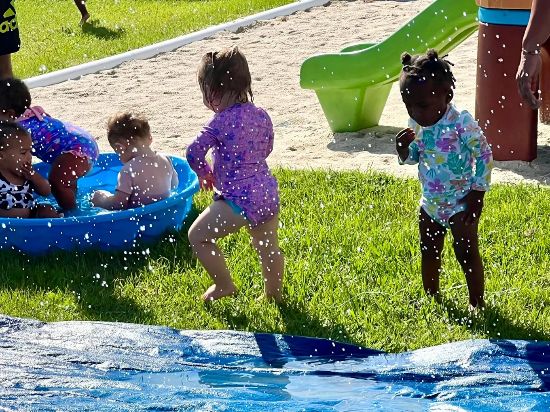 Preschool children playing and learning at Red Trolleys Daycare in Valdosta, GA.