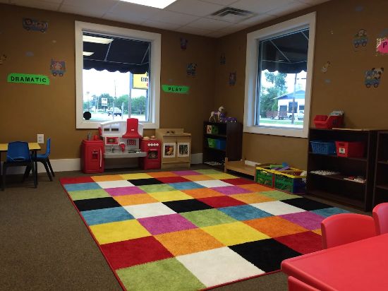 Happy preschoolers enjoying playtime at Red Trolleys Daycare in Valdosta, GA.