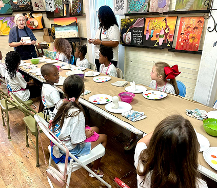Children participating in an art activity at Red Trolleys Daycare in Valdosta, GA.