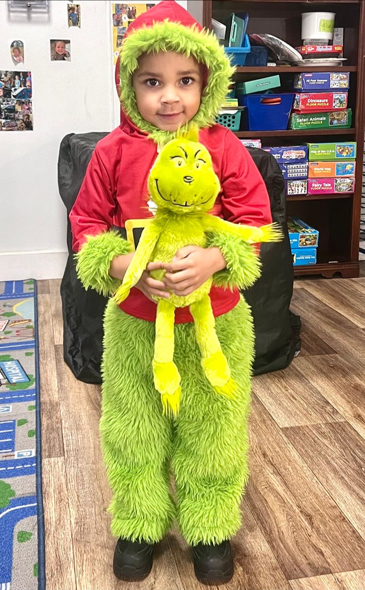 Child in a festive costume in the classroom at Red Trolleys Daycare in Valdosta, GA.