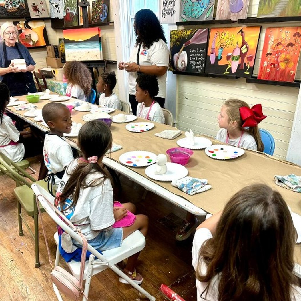 Children enjoying an art lesson at a summer camp in Valdosta, GA, with creative activities and engaging learning.